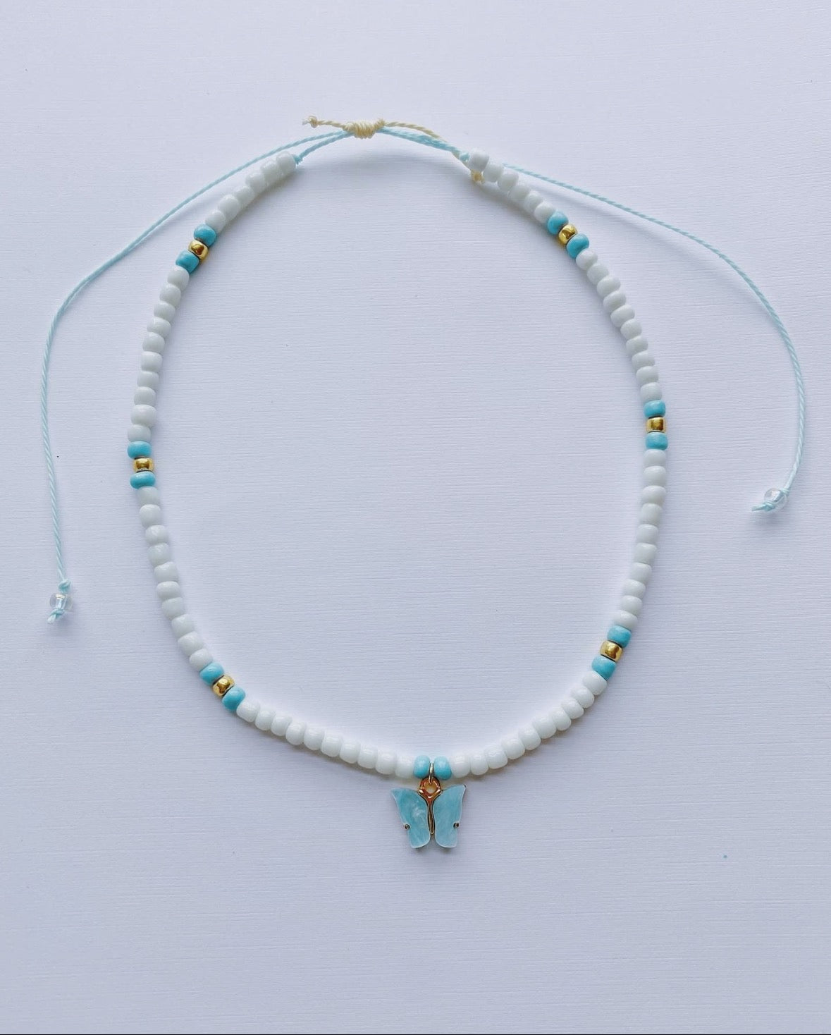 Buy MIXT by Nykaa Fashion Blue And Off White Beaded Shell Butterfly Necklace  Set Of 3 online