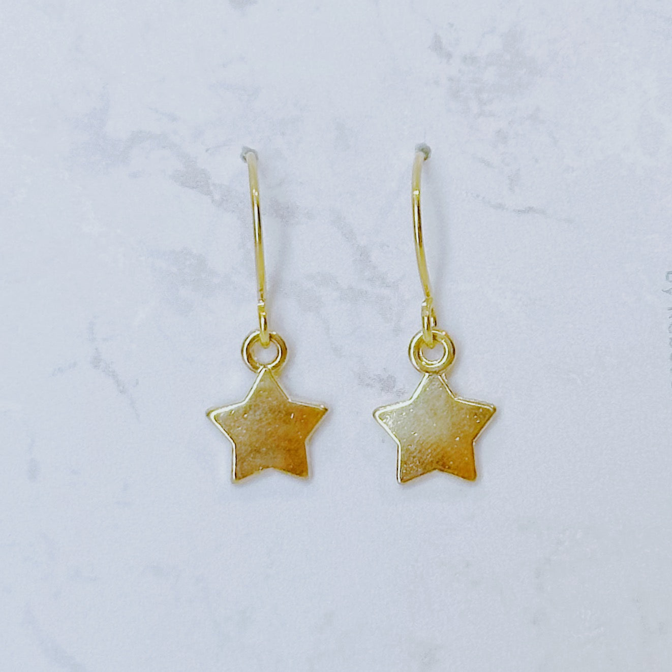 Star charm dangle earrings
