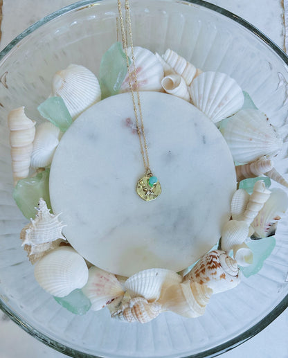 Gold sand dollar and turquoise gem necklace