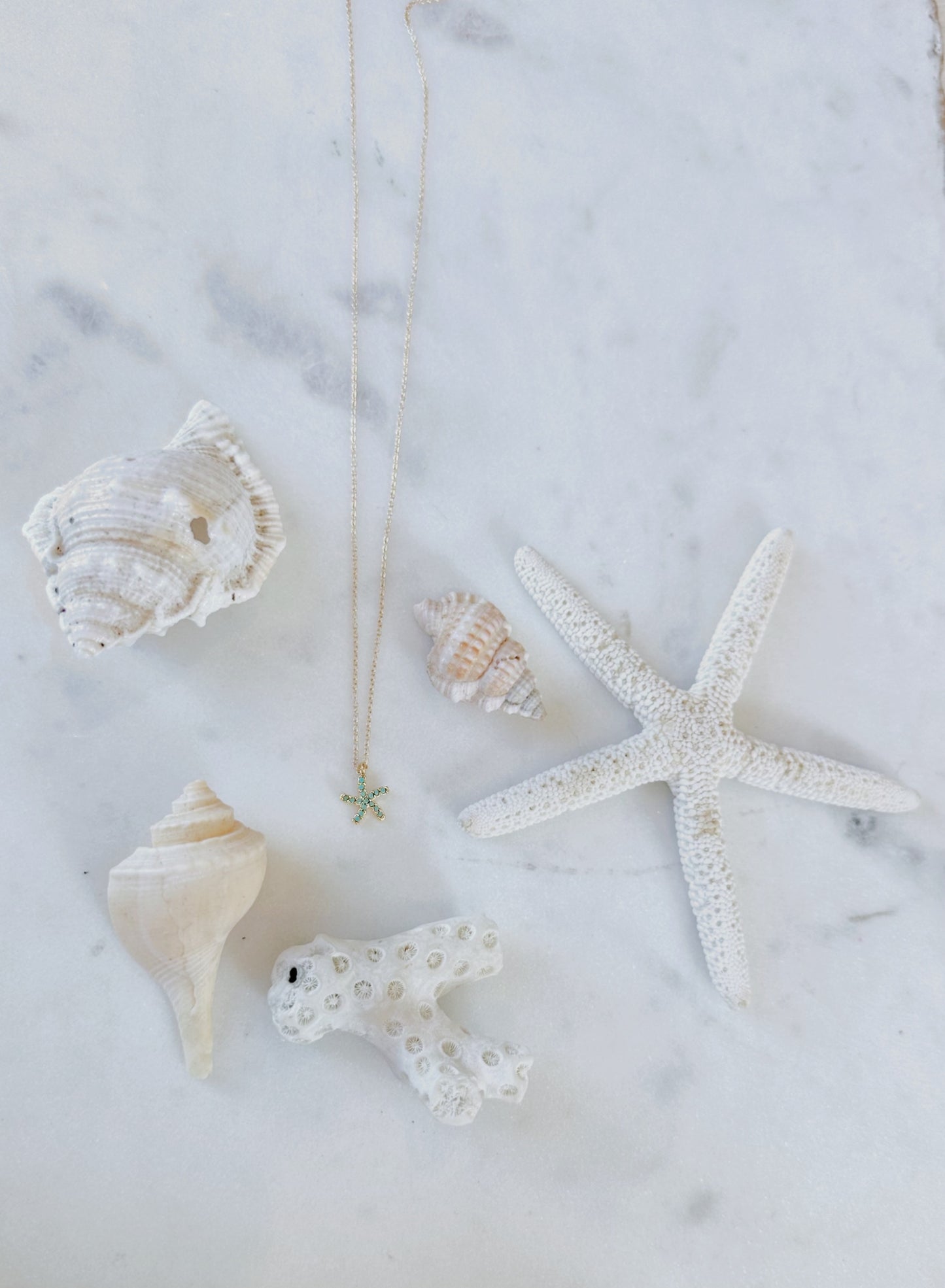 Dainty turquoise gem paved gold starfish necklace