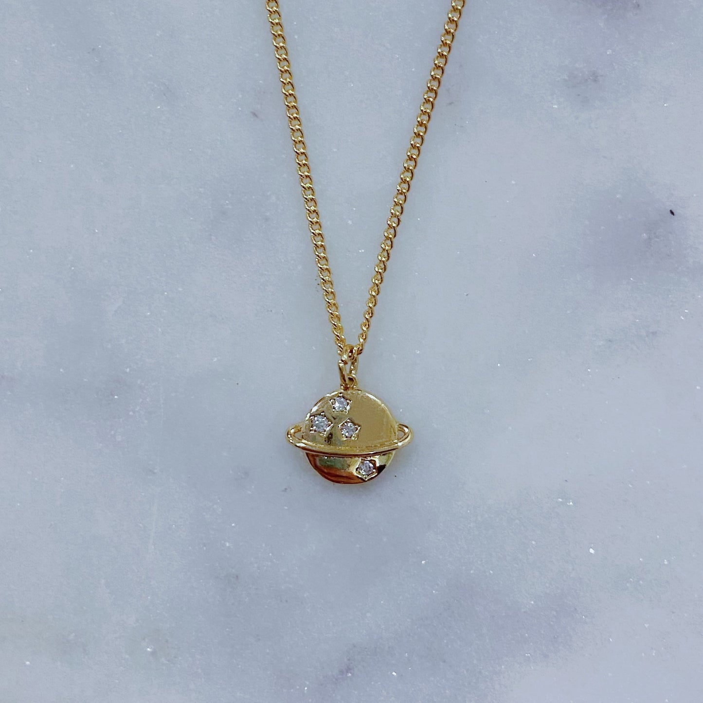 Saturn charm necklace