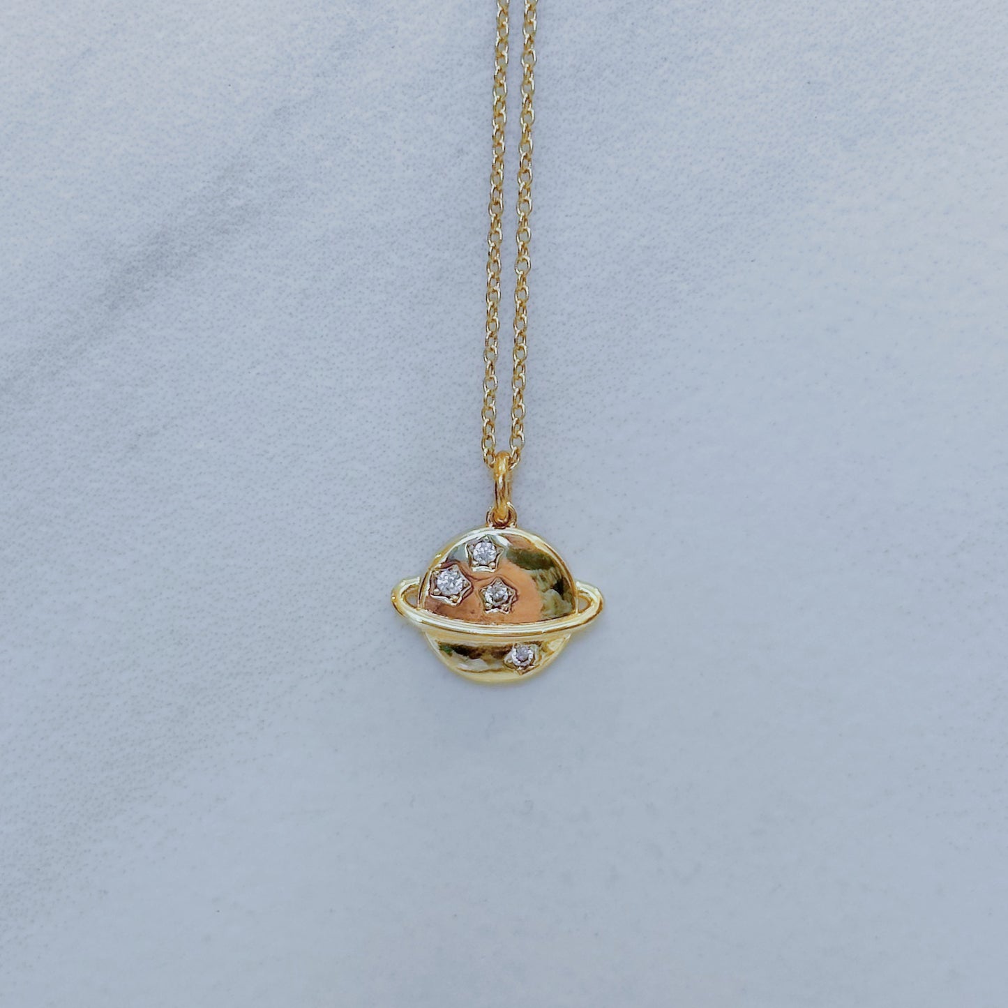 Saturn charm necklace