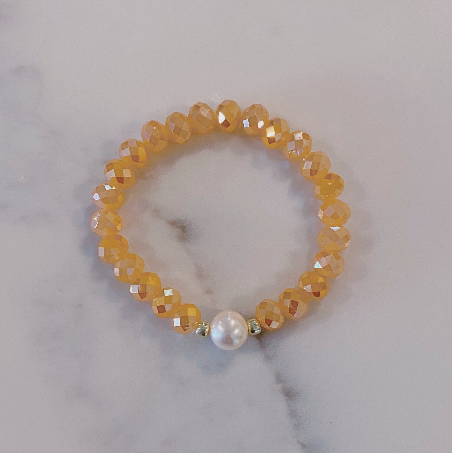 Peach faceted bead and pearl bracelet