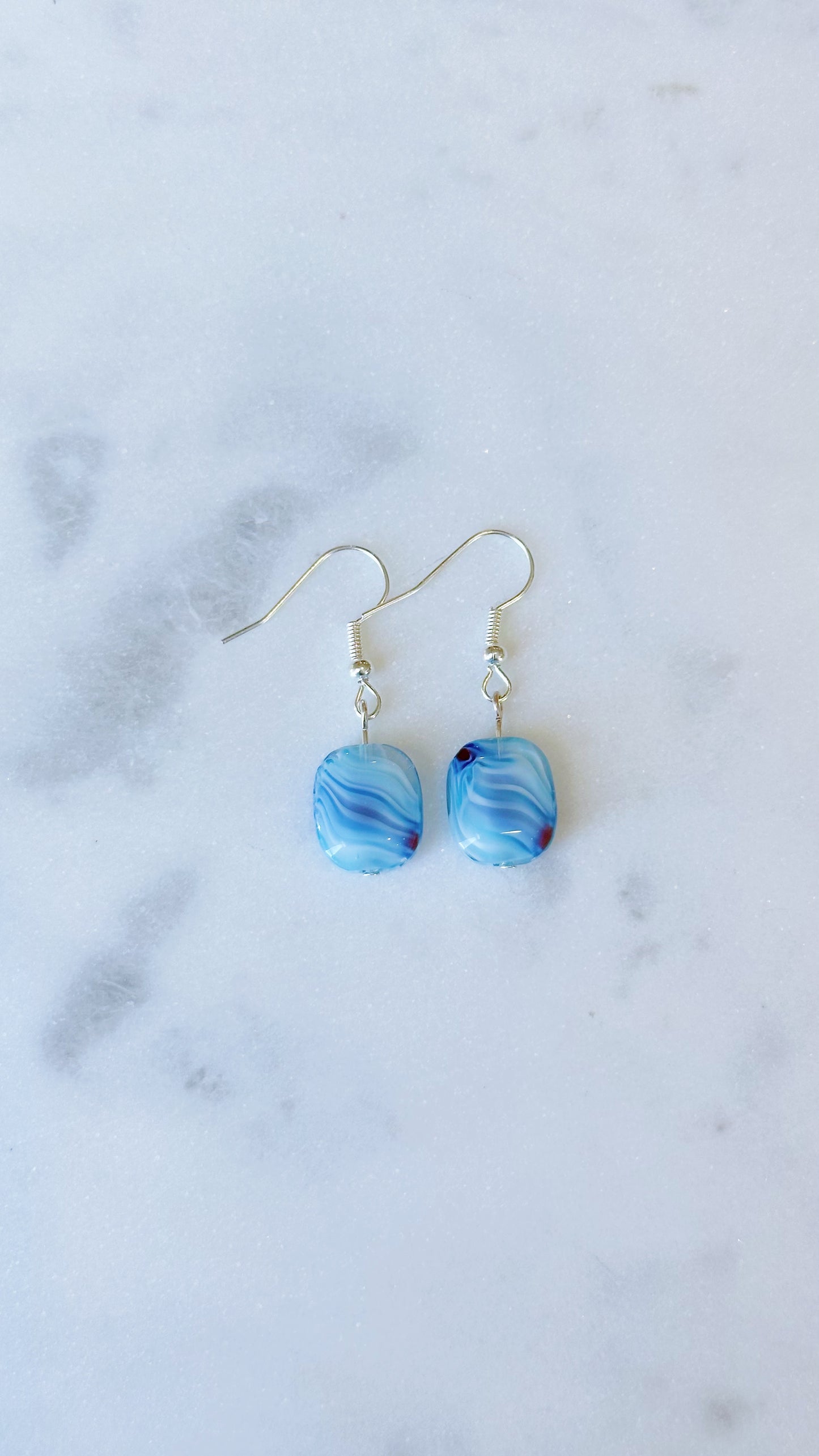 Blue glass swirl dangle earrings