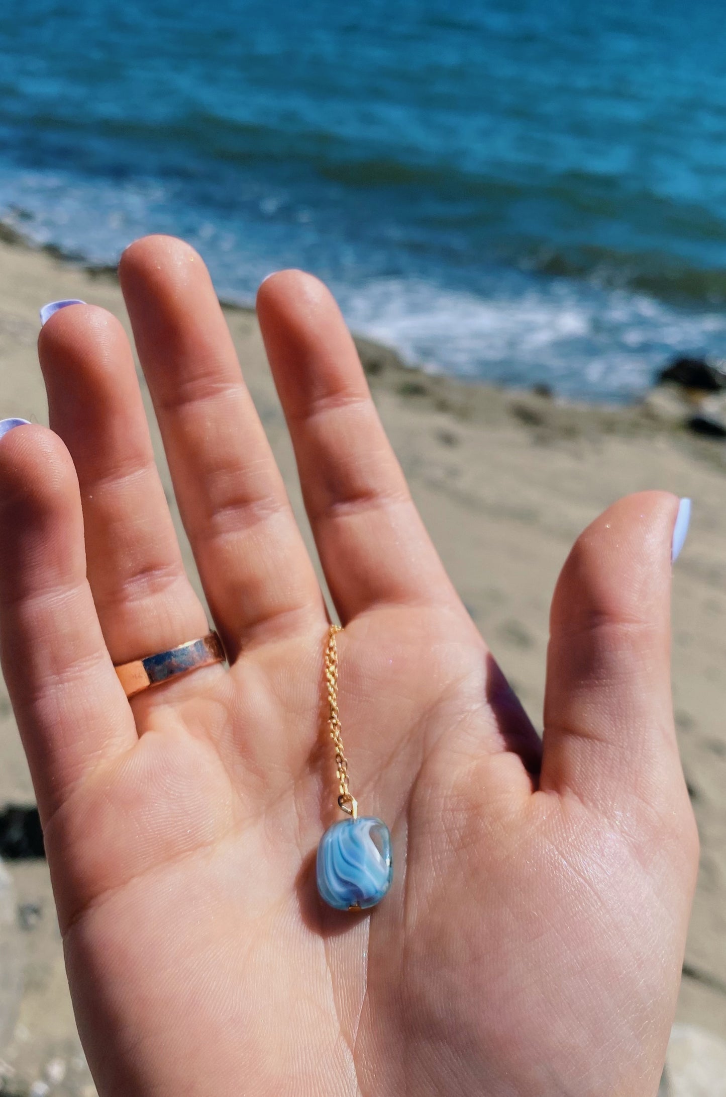 Light blue swirl pendant necklace
