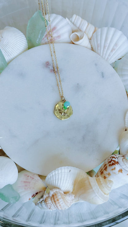 Gold sand dollar and turquoise gem necklace