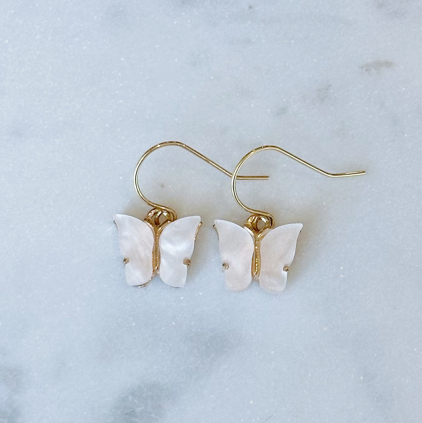 White enamel butterfly dangle earrings